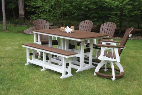 A patio dining set with a table, four chairs, and a bench, all in brown and white, on a grassy lawn.