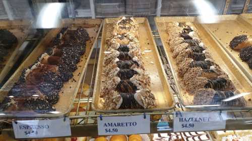 A display of three types of pastries: Espresso, Amaretto, and Hazelnut, each priced at $4.50.