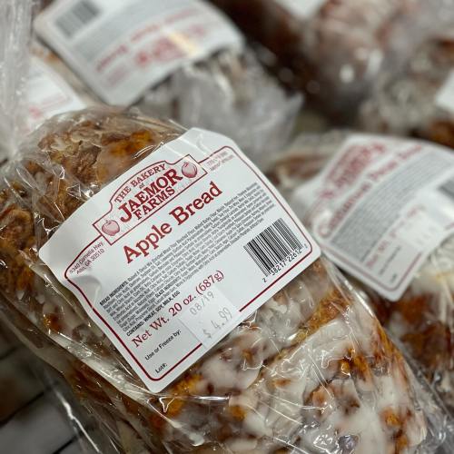 Loaf of apple bread in clear packaging, labeled with nutritional information and brand details.