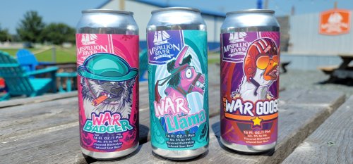 Three colorful beer cans featuring whimsical animal designs: War Badger, War Llama, and War Goose, on a wooden table.