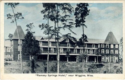 Historic postcard of Ramsey Springs Hotel near Wiggins, Mississippi, featuring a large wooden structure surrounded by trees.