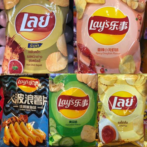 Various Lay's potato chip bags featuring unique flavors: hot chili squid, crab, grilled squid, and cucumber.