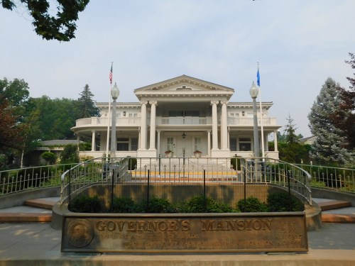 Historic Governor's Mansion in Nevada, featuring a grand facade with columns and a landscaped entrance.
