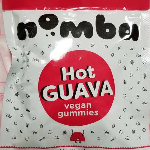 Packaging for Nomba Hot Guava vegan gummies, featuring a red and white design with playful illustrations.