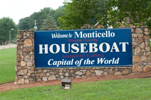 Sign welcoming visitors to Monticello, Wayne County, labeled as the "Houseboat Capital of the World."