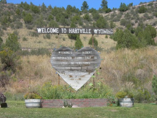 Sign welcoming visitors to Hartville, Wyoming, highlighting its status as the state's oldest incorporated town.