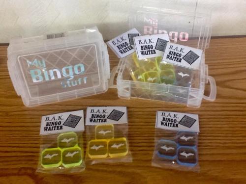 A clear container labeled "My Bingo Stuff" with colorful bingo markers and packets labeled "B.A.K. Bingo Waiter."