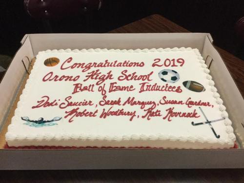 A decorated cake celebrating the 2019 OHS Hall of Fame inductees, featuring sports-themed designs and names.