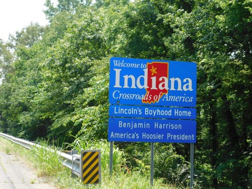 Welcome sign for Indiana, featuring "Crossroads of America" and mentions of Lincoln and Benjamin Harrison.