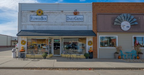 The charming storefronts of the Flower Box and Daily Grind cafe on Main Street in downtown Lemmon.