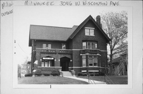 Historic brick building with a gabled roof, large windows, and decorative details, located at 3046 W. Wisconsin Ave, Milwaukee.