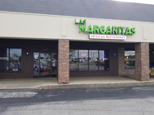 Exterior of Las Margaritas Mexican Restaurant, featuring a sign and large windows, with an "Open" notice visible.