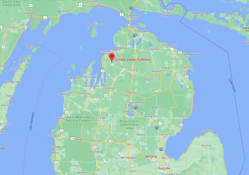 Map showing the location of Jordan Valley Outfitters in northern Michigan, surrounded by lakes and forests.