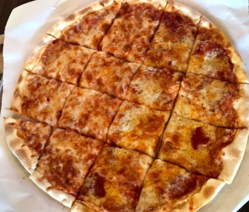 A round pizza cut into 16 square slices, topped with melted cheese and tomato sauce on a golden crust.