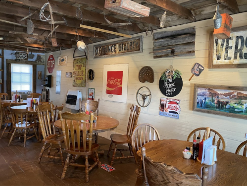 Cozy rustic diner interior with wooden tables, vintage signs, and a warm, inviting atmosphere.