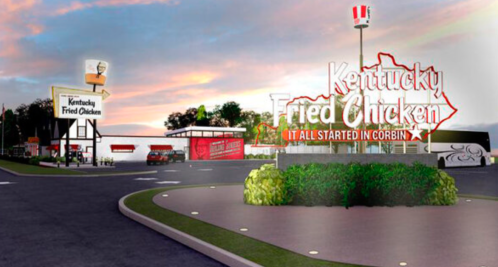 A Kentucky Fried Chicken restaurant in Corbin, featuring a large sign and a scenic sunset backdrop.
