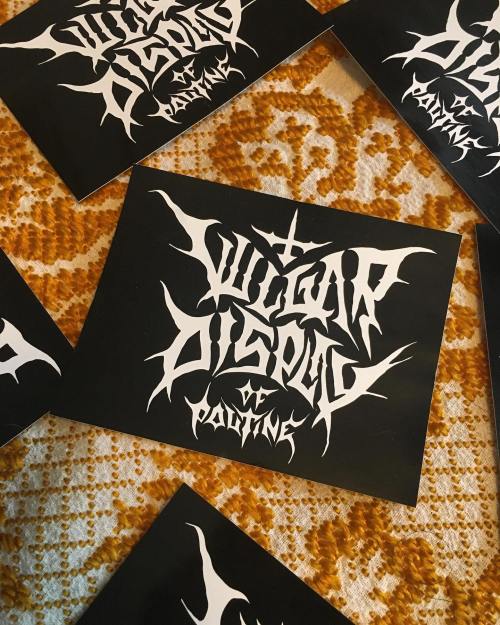 Black cards with intricate white lettering featuring the words "Guitar Dispel of Pain."