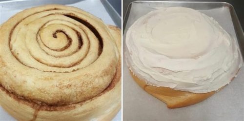 A freshly baked cinnamon roll on the left and a frosted cinnamon roll on the right, both on baking trays.