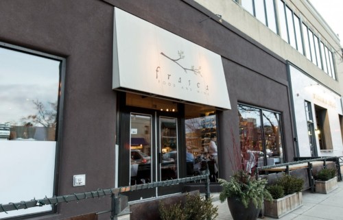Exterior of Frasca Food and Wine restaurant, featuring a modern facade and large windows.