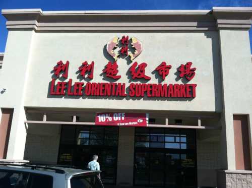 Exterior of Lee Lee Oriental Supermarket, featuring bold red signage and a promotional banner for 10% off.