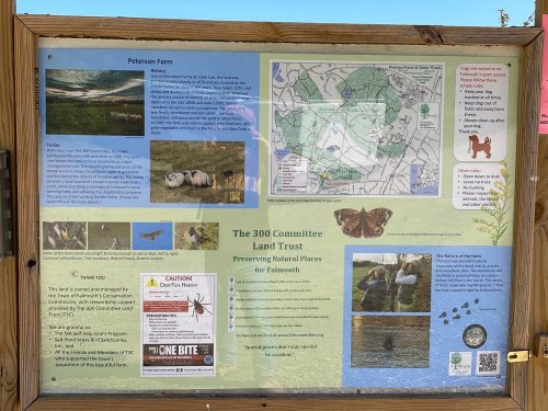 Informational sign about Peterson Farm and the 300 Committee Land Trust, featuring maps, wildlife, and conservation details.