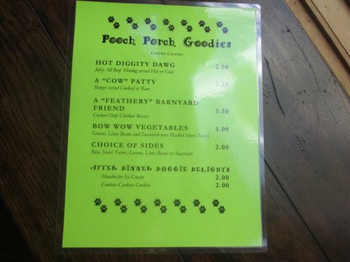Menu for "Pooch Porch Goodies" featuring dog treats like Hot Diggity Dawg, Barnyard Chicken, and more.