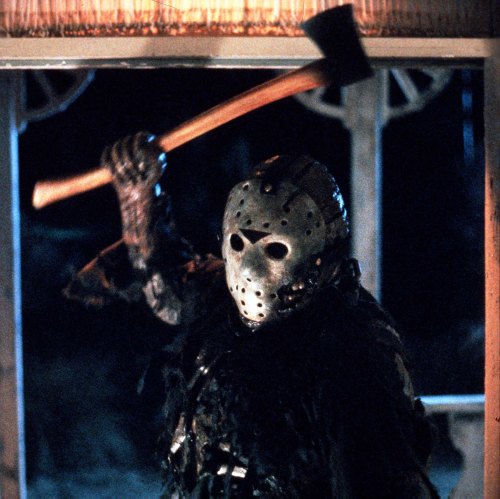 A masked figure in dark clothing raises an axe, standing in a shadowy outdoor setting.