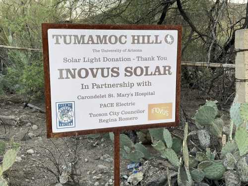 Sign at Tumamoc Hill thanking Inovus Solar for a solar light donation, in partnership with local organizations.