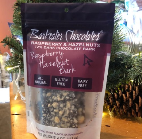 A package of Barkeder Chocolates Raspberry Hazelnut Bark, featuring 72% dark chocolate, labeled gluten and dairy-free.