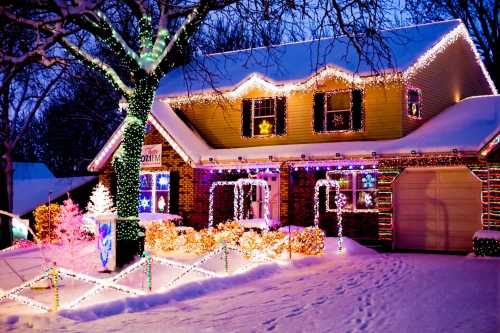 A cozy house decorated with colorful Christmas lights, surrounded by snow and festive decorations.