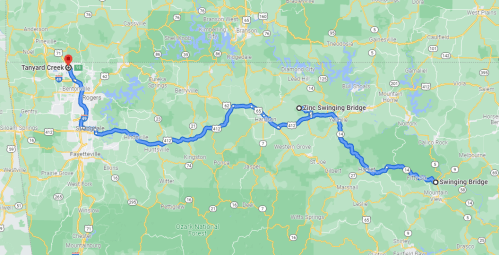 Map showing a route from Tanyard Creek to Ozark Swinging Bridge, highlighting roads and surrounding areas.