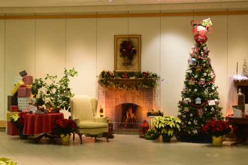 A cozy holiday scene featuring a decorated Christmas tree, a fireplace, and festive plants and gifts.