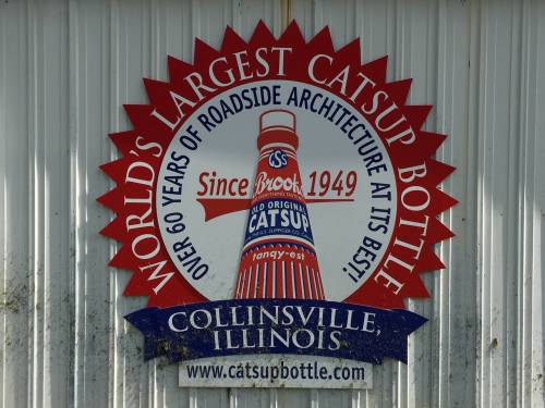 Sign for the World's Largest Catsup Bottle in Collinsville, Illinois, celebrating over 60 years of roadside architecture.