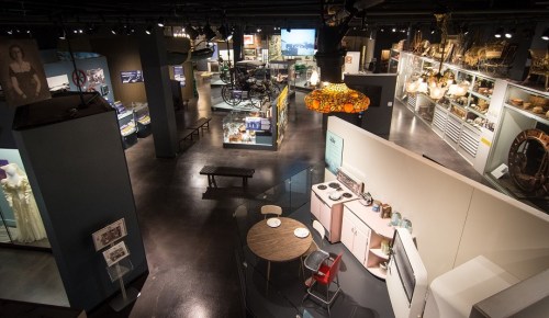 Aerial view of a museum exhibit featuring vintage items, including a kitchen setup and various historical displays.