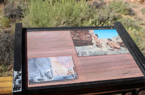 Information sign titled "Stories in Stone" with images and text about rock art and its historical significance.