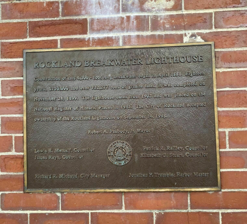 Plaque detailing the history and construction of the Rockland Breakwater Lighthouse, established in 1902.