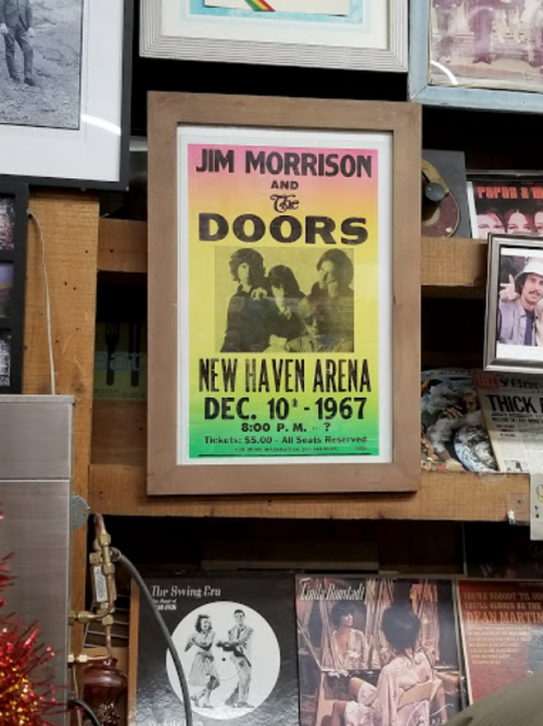 A vintage concert poster for The Doors, featuring Jim Morrison, dated December 10, 1967, at New Haven Arena.