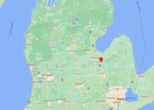 Map of Michigan highlighting Saginaw with surrounding areas and bodies of water.