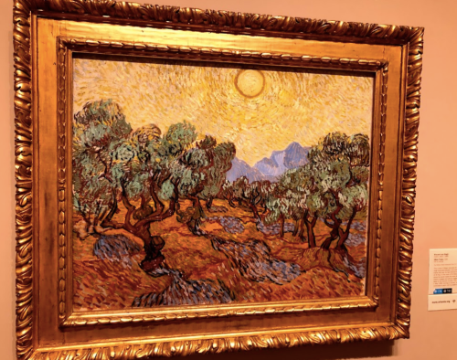 A vibrant painting of olive trees under a bright sun, framed in ornate gold, showcasing swirling brushstrokes.