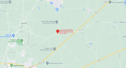 Map showing the Grand Bay Wildlife Management Area, located near Bemiss and Eastwind Park, with nearby roads and landmarks.