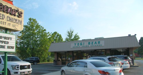 An exterior view of the yogi bear fried chicken restaurant in South Carolina.