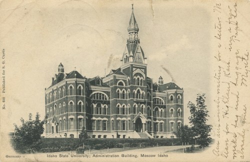 Historic postcard of Idaho State University's Administration Building in Moscow, Idaho, featuring ornate architecture.
