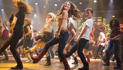 A lively dance scene with a diverse group of people performing synchronized moves in a vibrant setting.