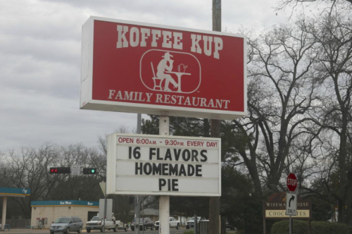 Sign for Koffee Kup Family Restaurant featuring "16 Flavors" and "Homemade Pie," open daily from 6 AM to 9:30 PM.