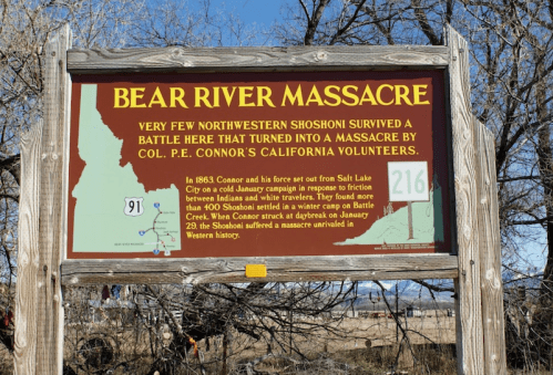 Sign marking the Bear River Massacre site, detailing the historical event and its impact on the Northwestern Shoshoni.