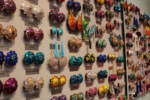 A colorful display of various decorative hair accessories arranged on a wall, showcasing different styles and designs.