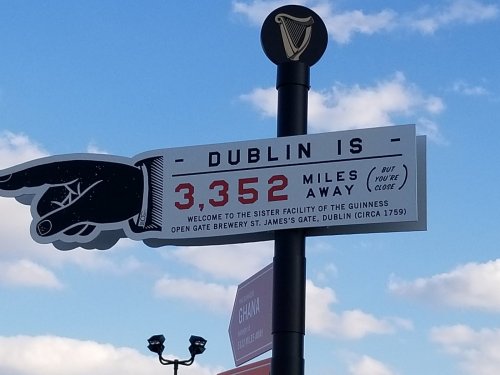Sign indicating "Dublin is 3,352 miles away," with details about the Guinness Open Gate Brewery.