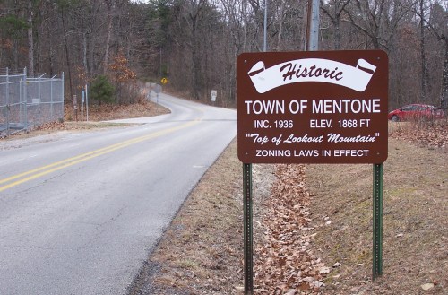 Sign for the historic Town of Mentone, elevation 1868 ft, located at the top of Lookout Mountain, with zoning laws in effect.