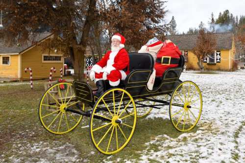Santa Claus sits in a horse-drawn carriage, surrounded by snowy ground and festive decorations.