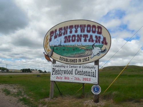 Sign for Plentywood, Montana, established in 1912, celebrating its centennial from July 4th to 7th, 2012.